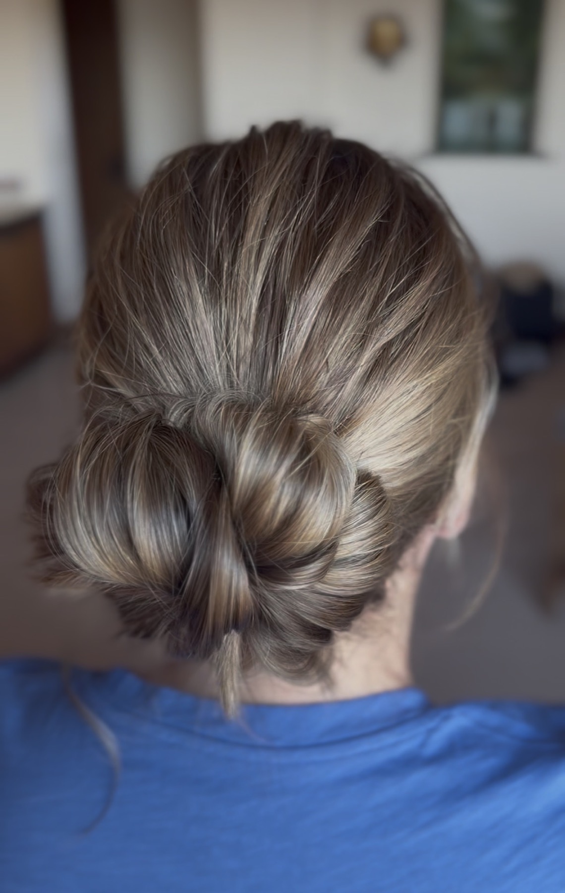 Polished low bridal bun