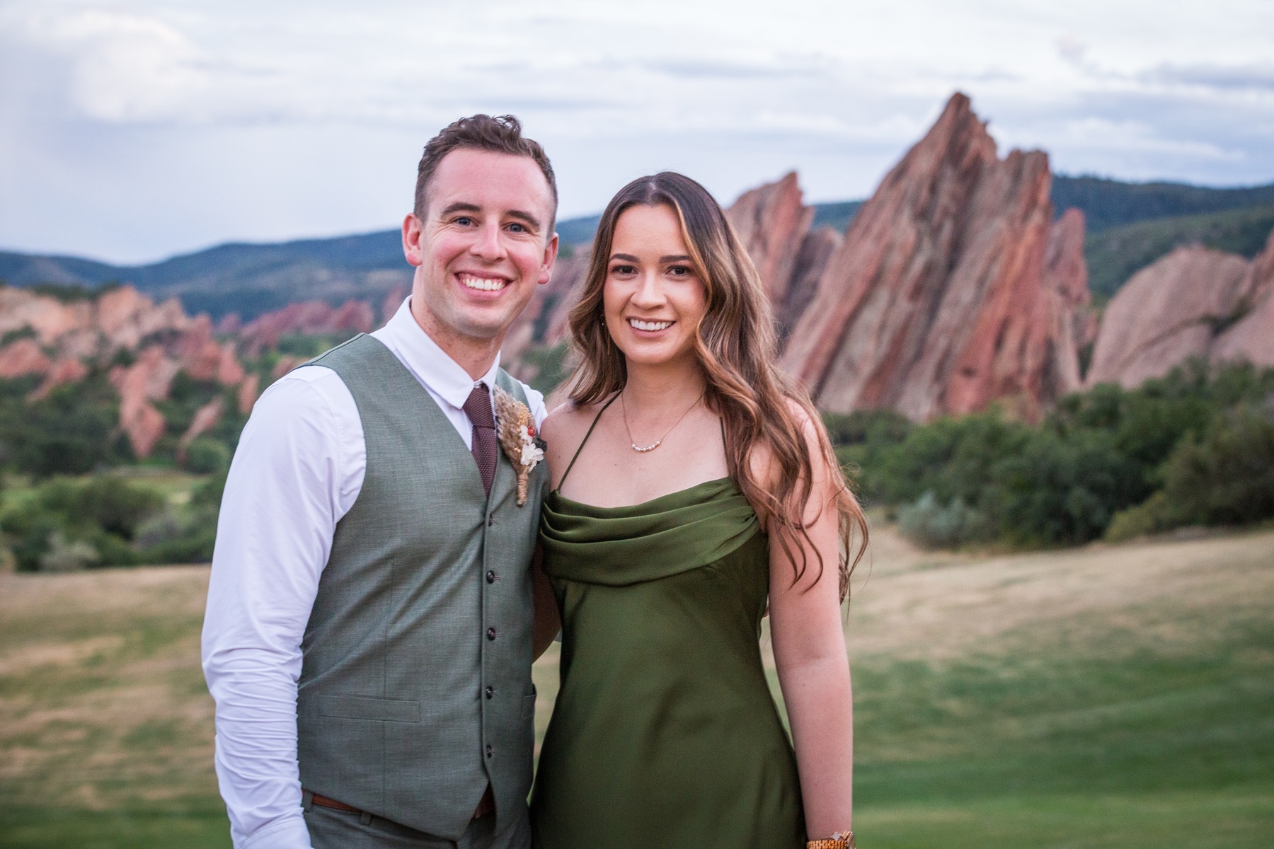 Smiling couple in front of Colorado red rock formations
