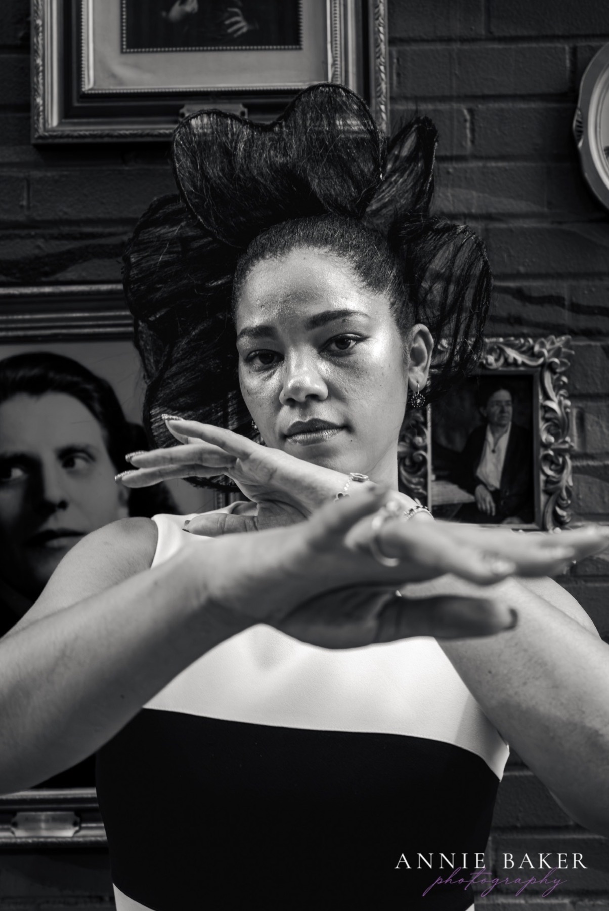 Black and white editorial portrait with sculptural hair