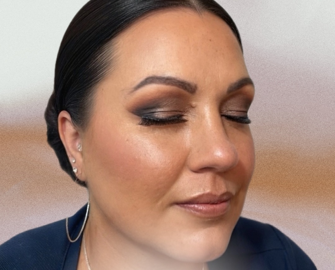 Smoky bridal eye makeup with a sleek low bun